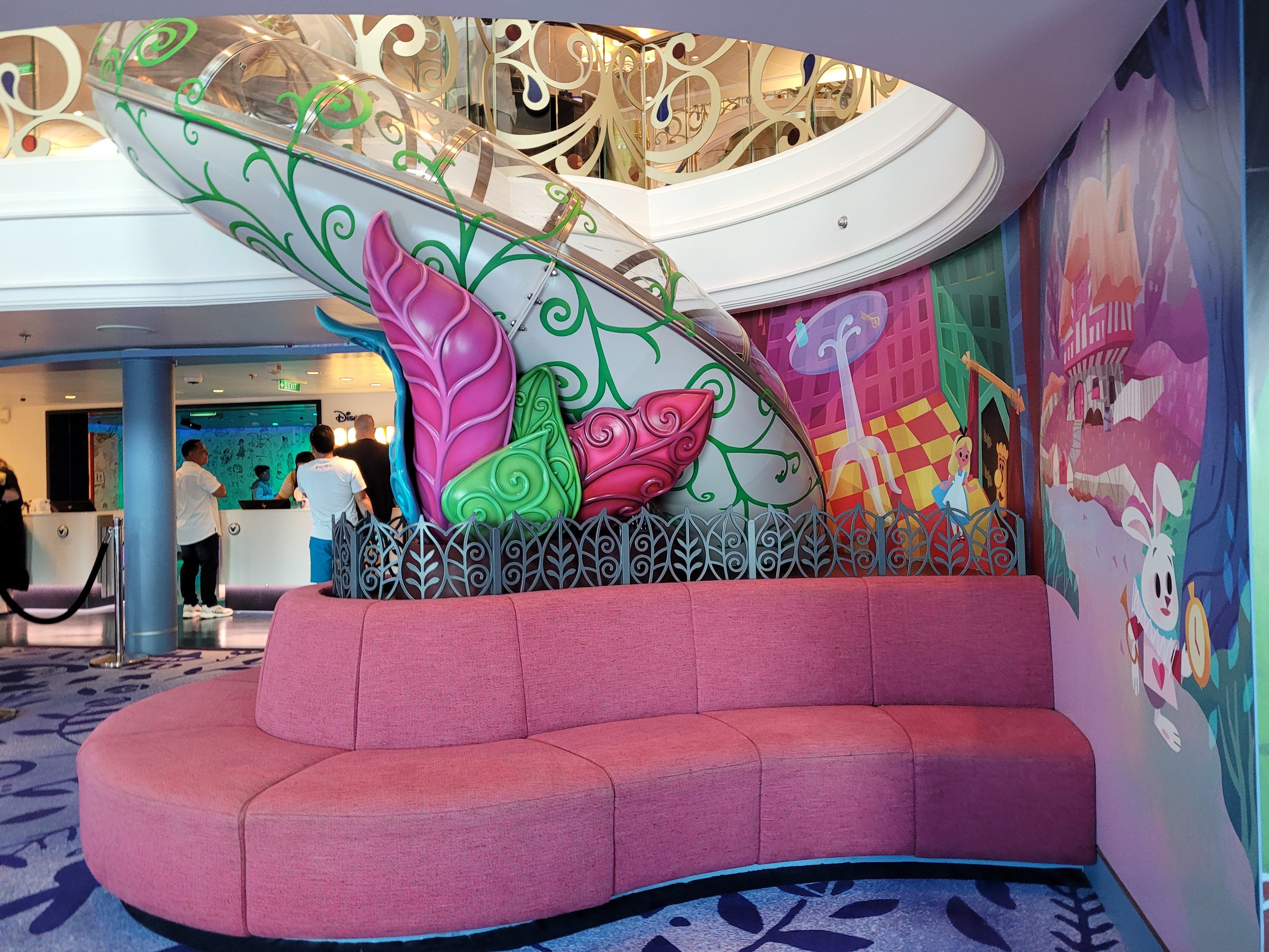 The Oceaneer Club entrance on the Disney Wish, Alice in Wonderland mural