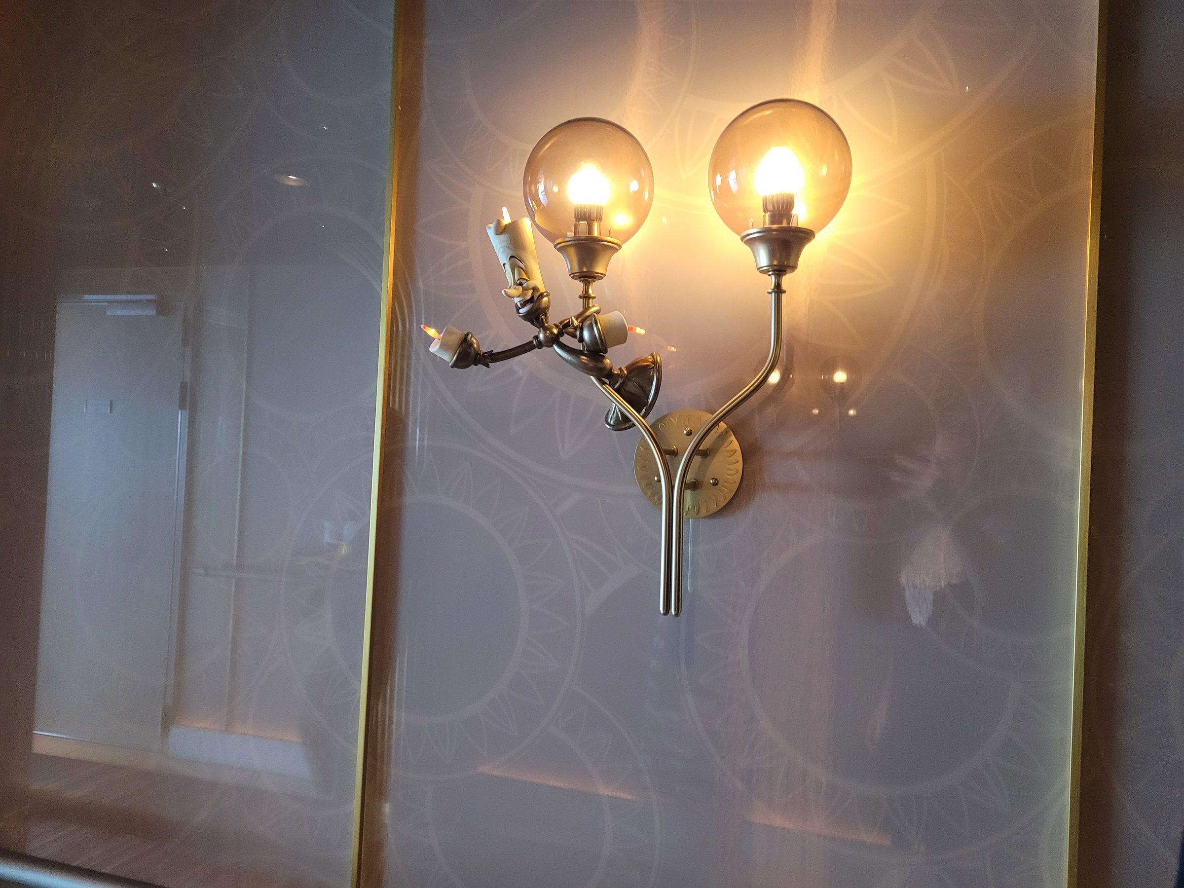 Lumière wall sconce in Enchanté, inspired by the character