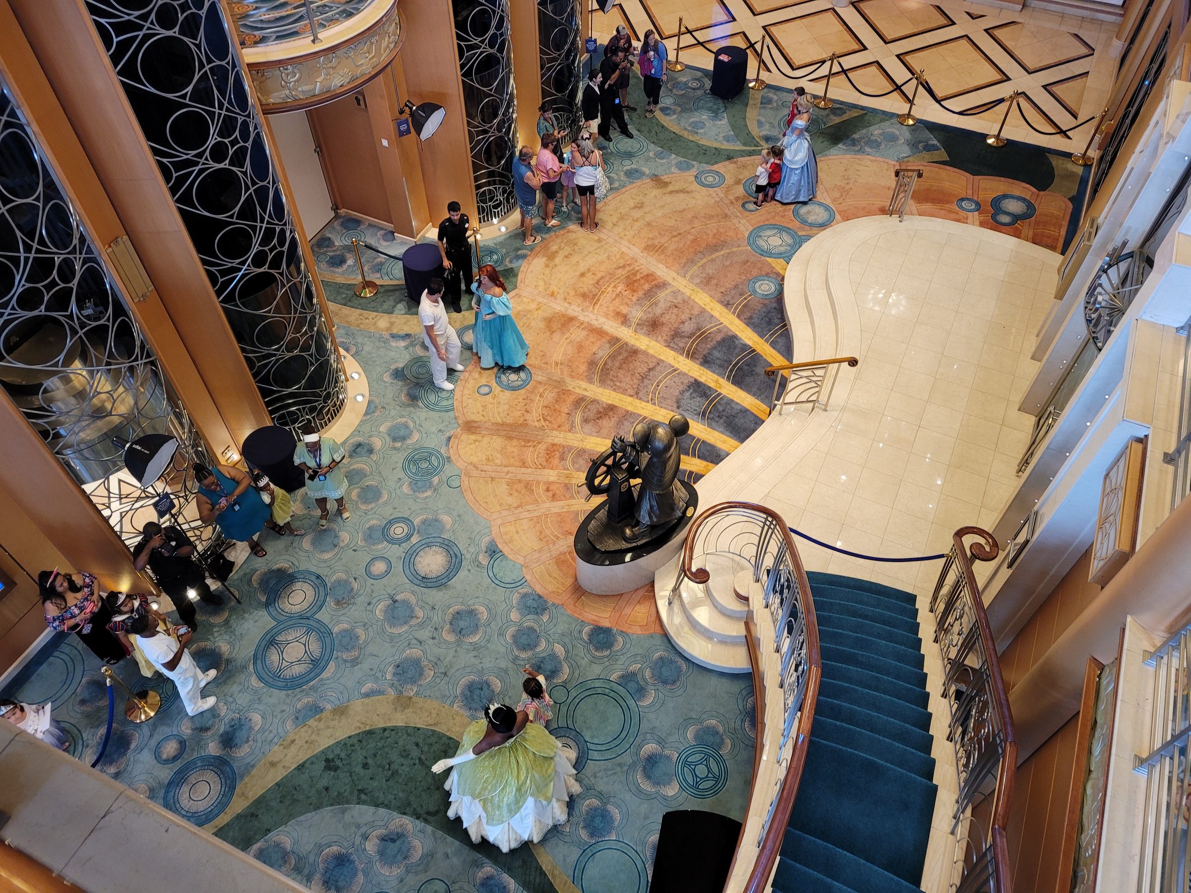 Overhead view of the Disney Wish atrium during a princess gathering