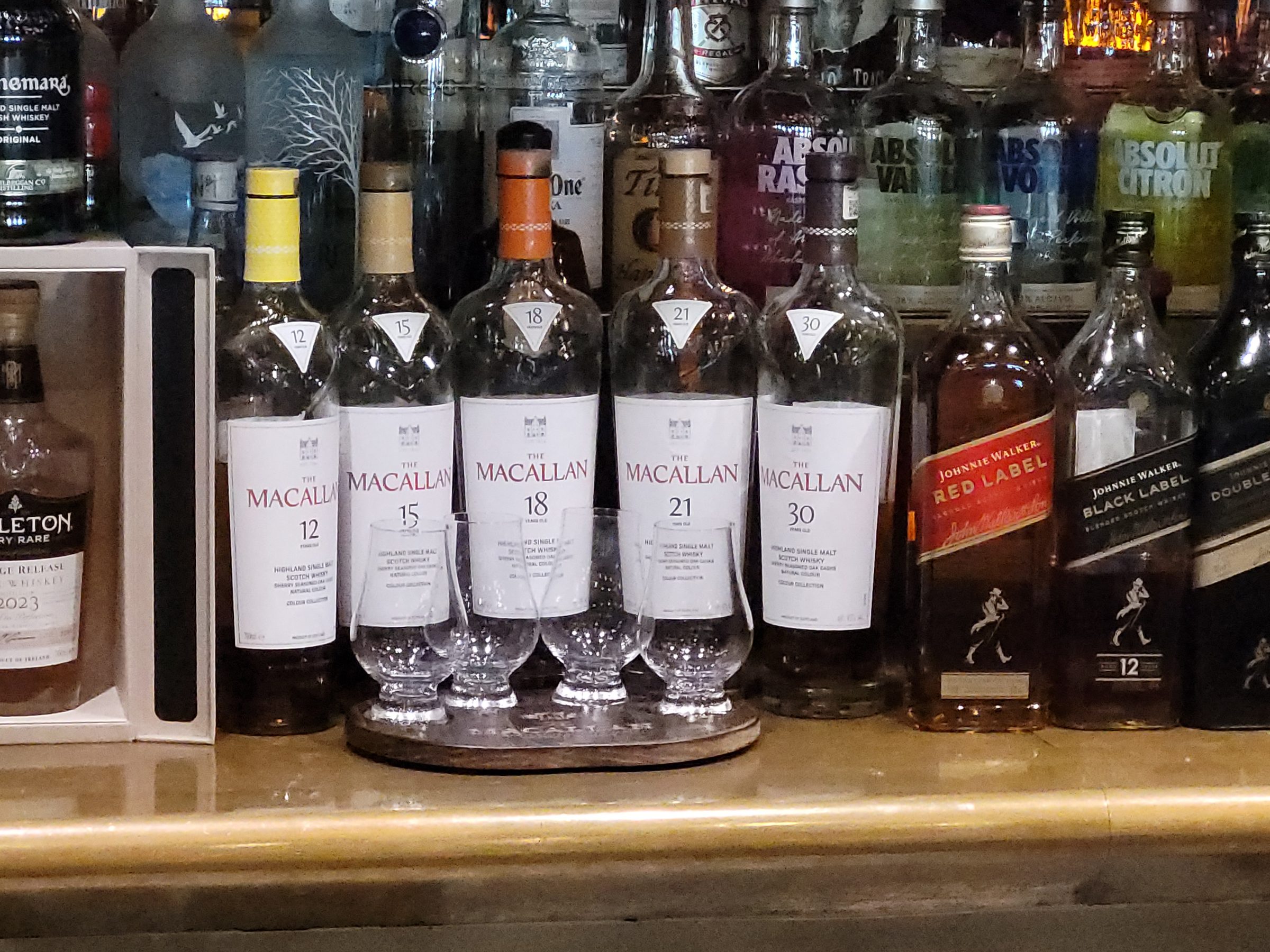 The Macallan whisky lineup at the bar on the Disney Wish